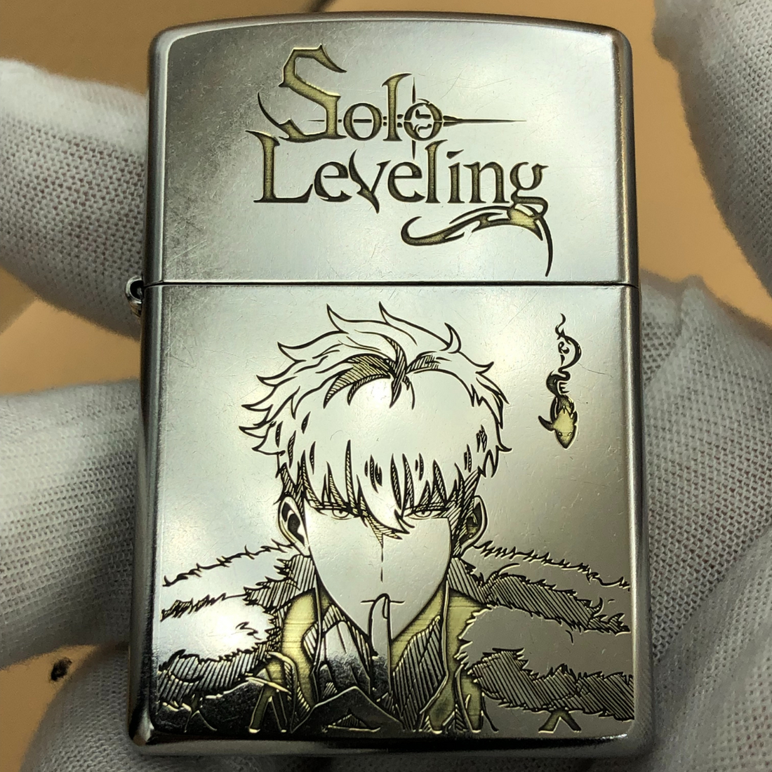 Front view of Solo Leveling Zippo lighter featuring engraved Sung Jin-Woo design, silver metal finish with shadow symbol